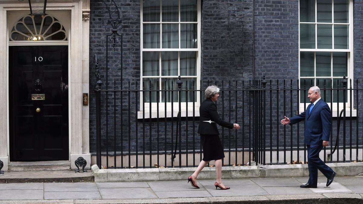 British Prime Minister Theresa May greets Israeli Prime Minister Benjamin Netanyahu outside 10 Downing St. in London on Nov. 2, 2017.