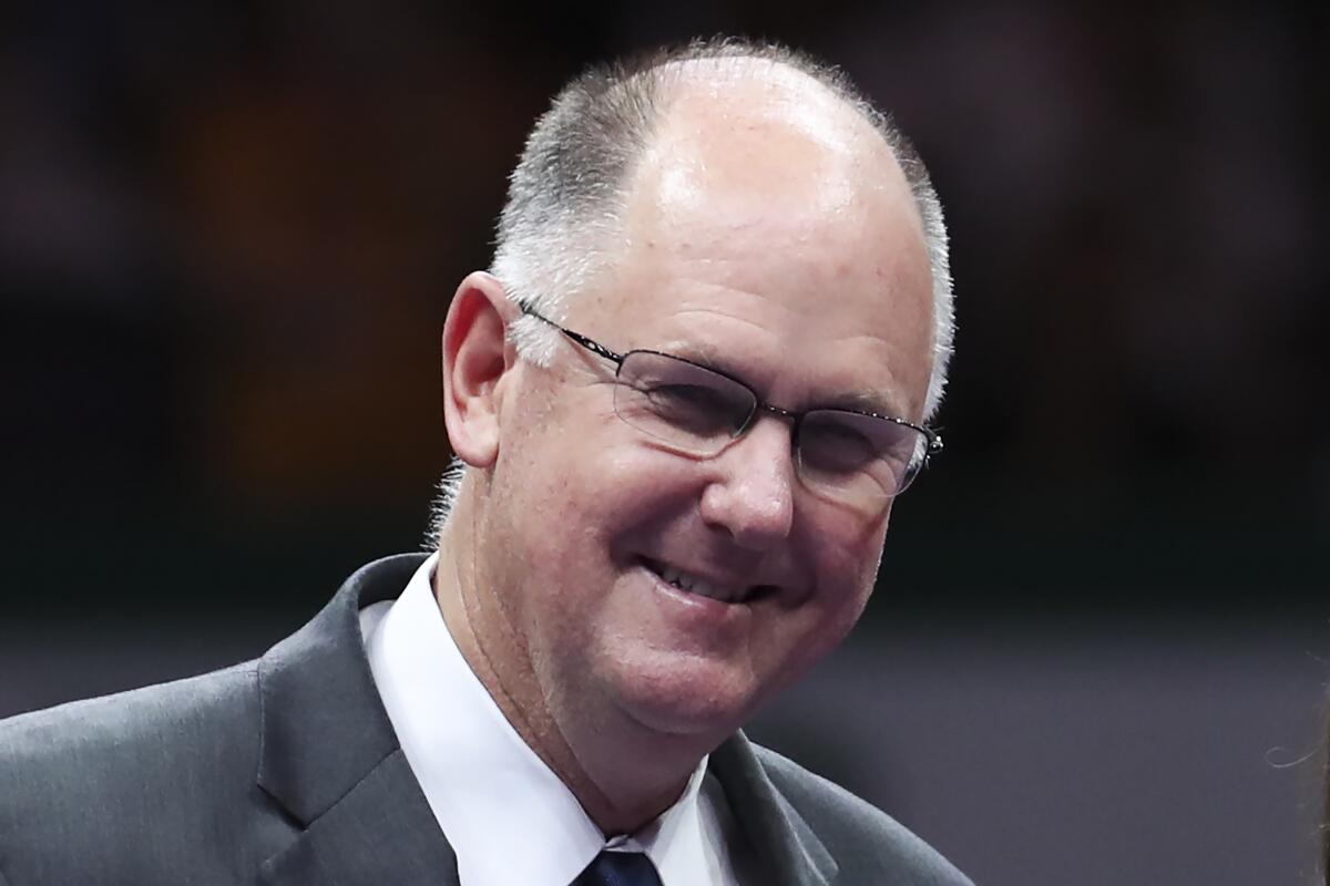 WTA CEO Steve Simon smiles during an appearance at a retirement ceremony for Martina Hingis in Singapore.