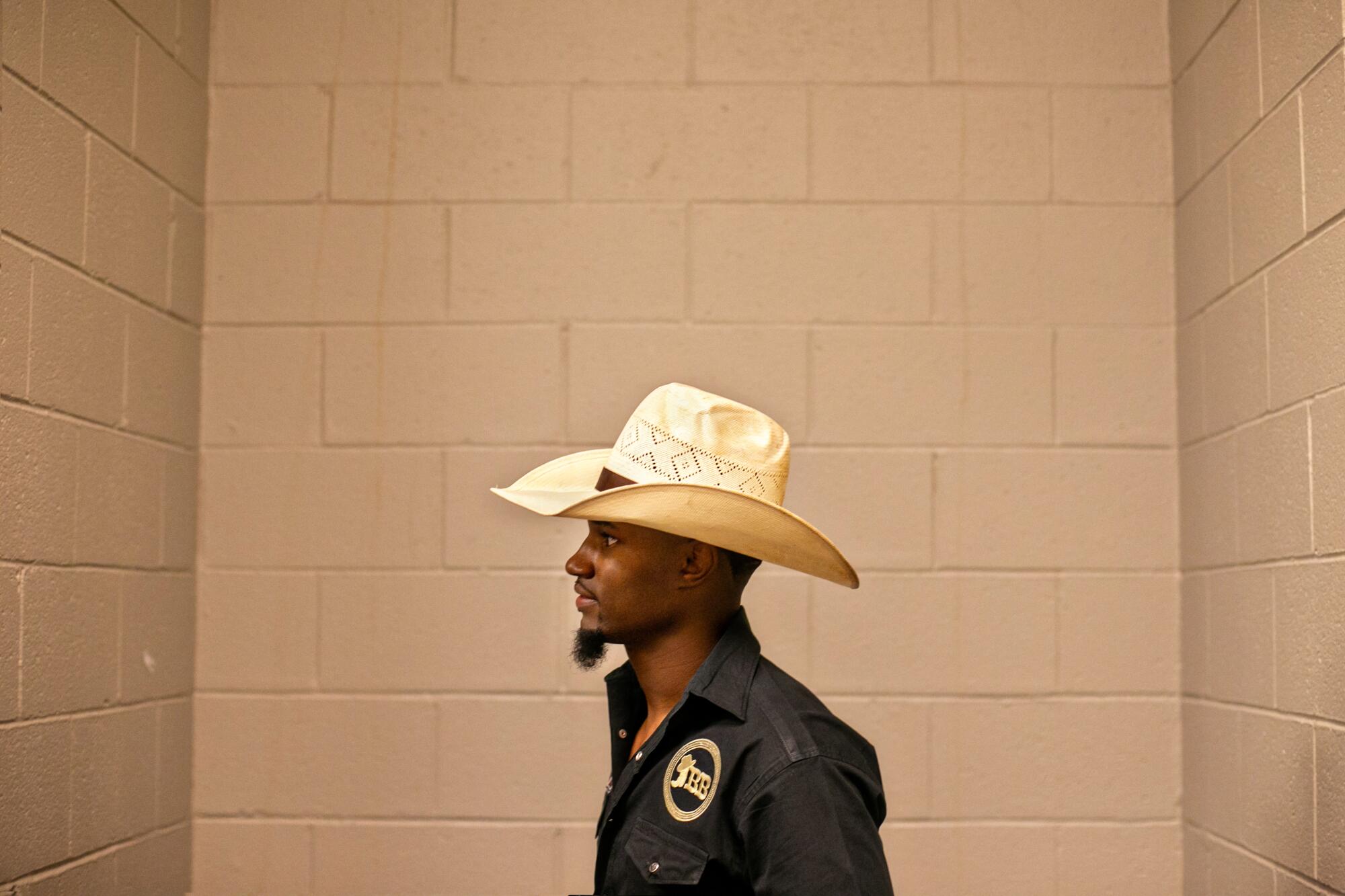 A cowboy stands in the corner of the locker room at the MGM Grand Arena 