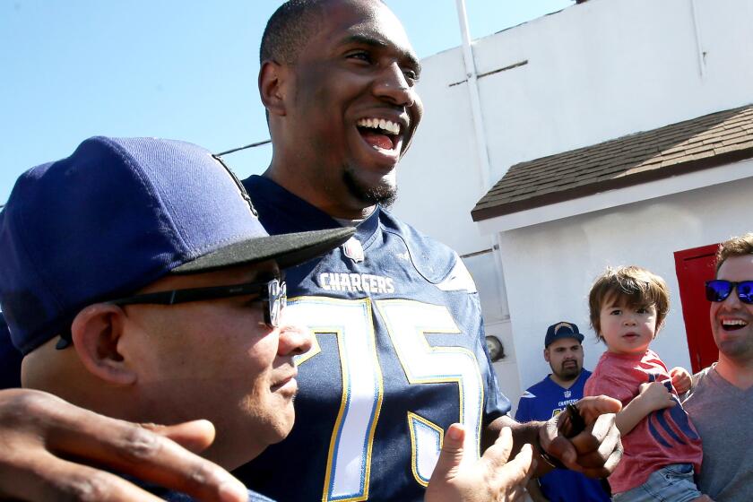 Chargers offensive tackle Chris Hairston greets fans in an appearance at Pink's Hot Dogs in Los Angeles on Tuesday.