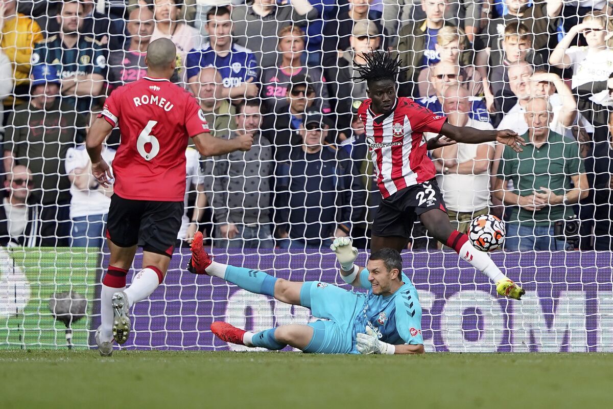 Southampton's Mohammed Salisu, right, clears the ball off the line during an English Premier League soccer match against Leeds United at St. Mary's Stadium in Southampton, England, Saturday, Oct. 16, 2021. (AP Photo/Steve Luciano)