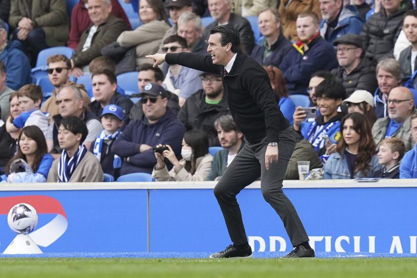 Aston Villa manager Unai Emery gestures on the touchline during the Premier League match between Brighton & Hove Albion and Aston Villa, at the American Express Stadium in Brighton, England, Sunday May 5, 2024. (Gareth Fuller/PA via AP)
