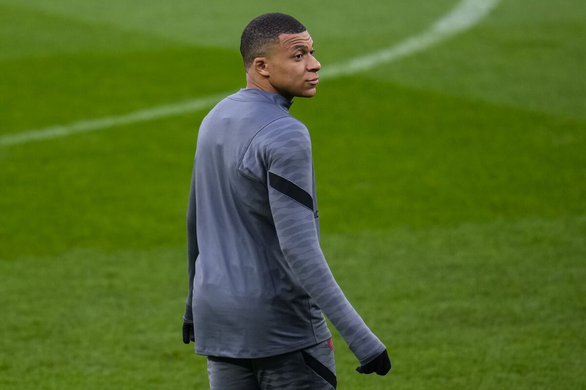 PSG's Kylian Mbappe attends a training session at the Bernabeu stadium in Madrid, Spain, Tuesday, March 8, 2022. Real Madrid will play its Champions League soccer match against Paris Saint-Germain on Wednesday. (AP Photo/Manu Fernandez)
