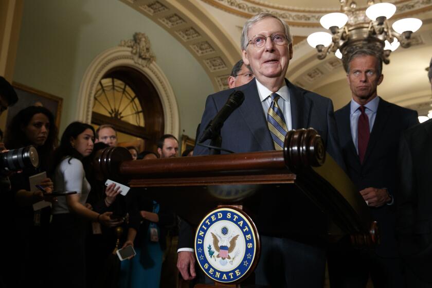 Senate Majority Leader Mitch McConnell of Ky., smiles as he speaks to members of the media, next to Sen. John Thune, R-S.D., right, Tuesday Sept. 24, 2019, after a Republican policy luncheon on Capitol Hill in Washington. (AP Photo/Jacquelyn Martin)