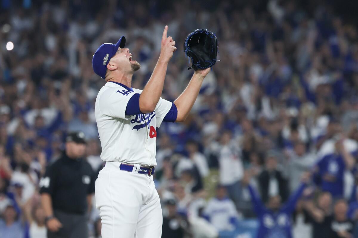 Dodgers reliever Blake Treinen celebrates after striking out Manny Machado to end the game.