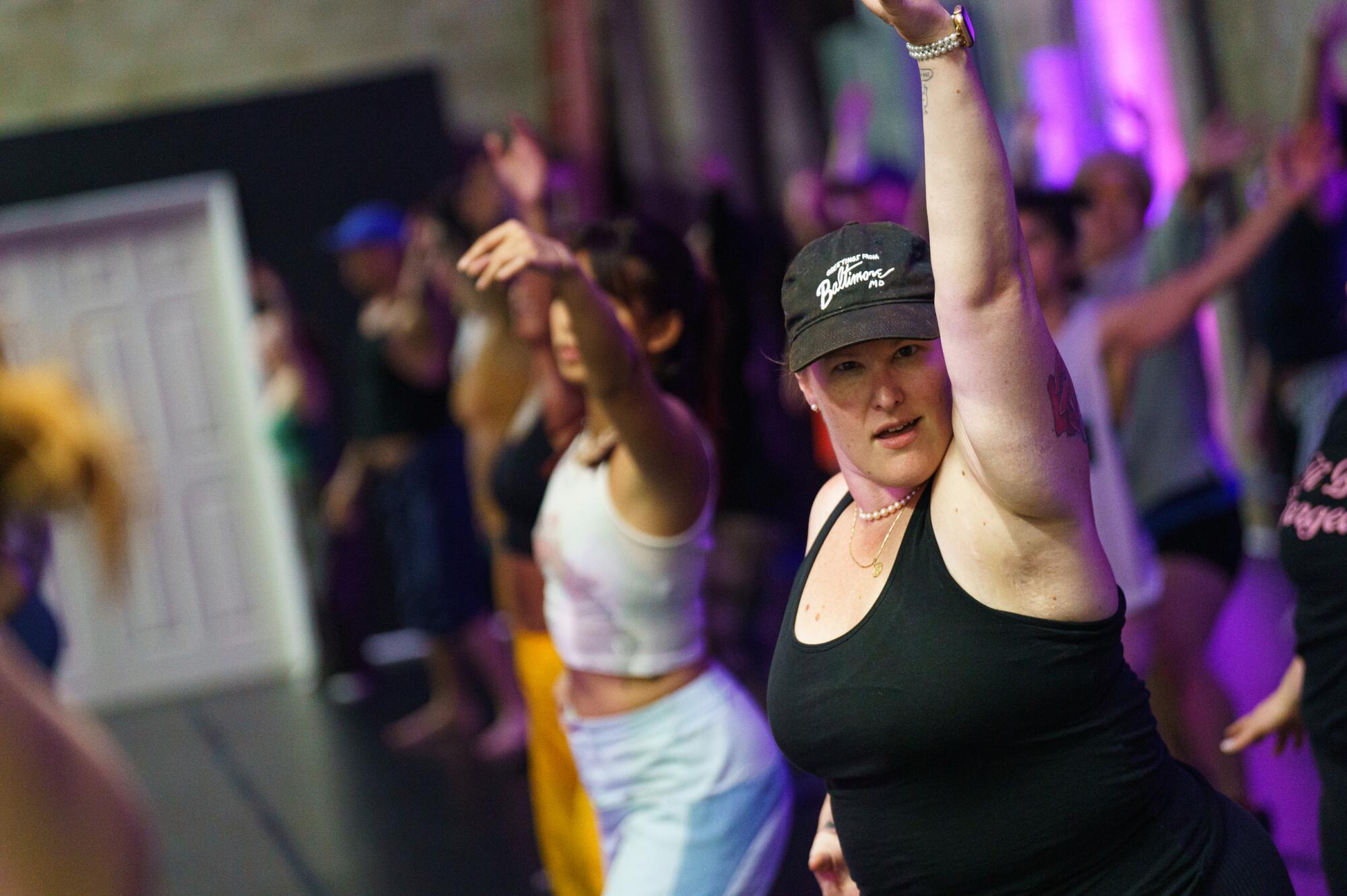 People learning choreography to a pop song.