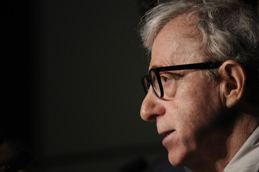 Woody Allen wearing glasses in profile