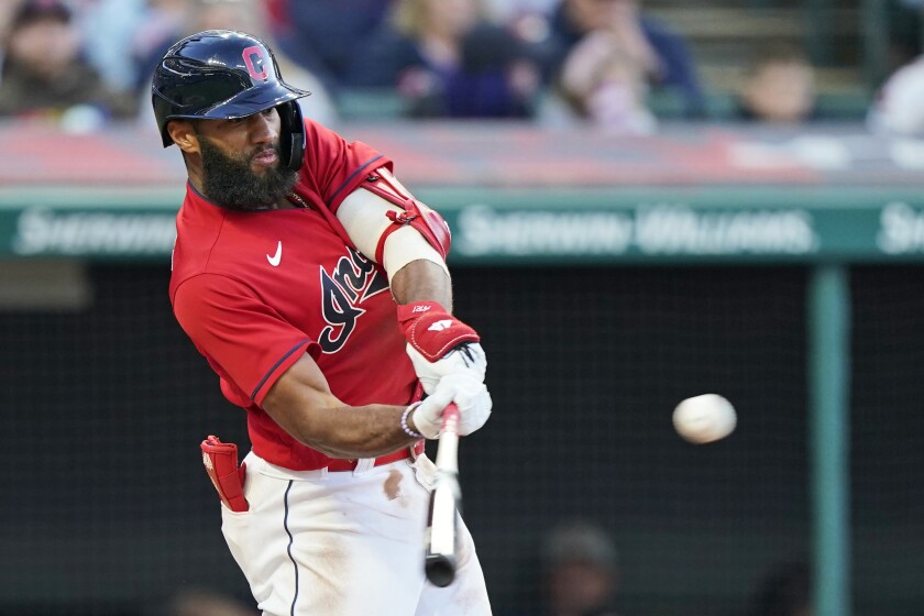 Cleveland Indians' Amed Rosario hits an RBI-single in the fourth inning of a baseball game against the Baltimore Orioles, Tuesday, June 15, 2021, in Cleveland. (AP Photo/Tony Dejak)