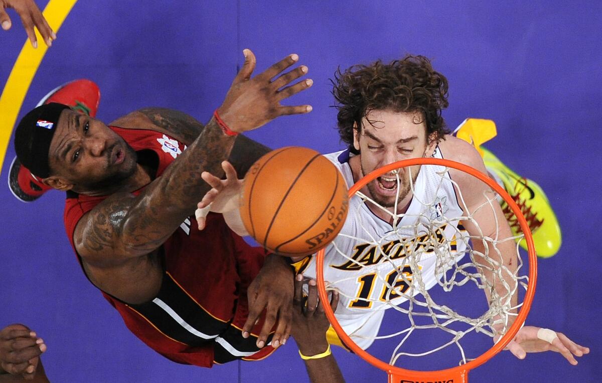 Lakers forward Pau Gasol, right, and Miami Heat forward LeBron James battle for a rebound during Christmas Day game in 2010.