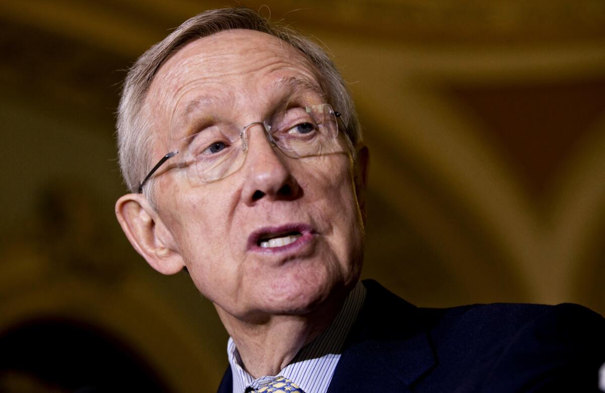 Senate Majority Leader Harry Reid of Nev. is seen meeting with reporters following a Democratic policy luncheon on Capitol Hill in Washington.