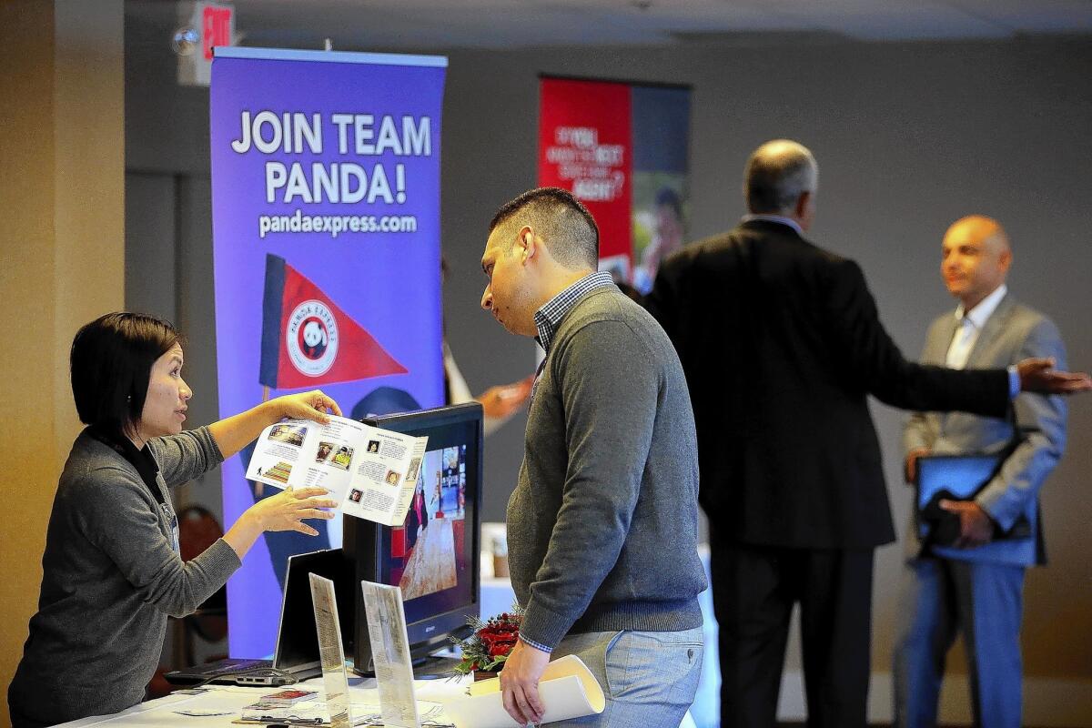 Job seekers meet with recruiters during a HireLive career fair in San Francisco. The labor market has failed to keep up with population growth and continues to struggle to create higher-wage jobs.