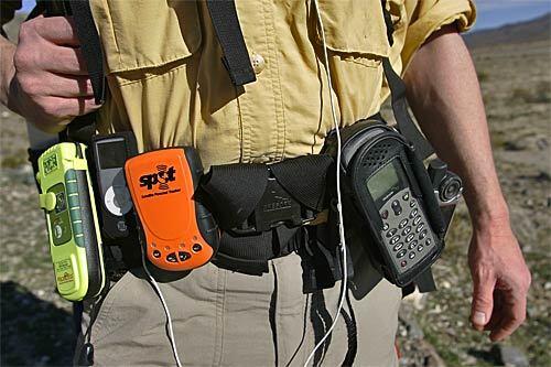 The electronic devices on Dan Neil's utility belt aren't there just to add color to his ensemble. On a recent solo jaunt through rugged Joshua Tree National Park, the Times writer carried 21st century communications devices as his safety net. They included a satellite phone, a GPS unit, a locator beacon and a solar charger for his iPod.