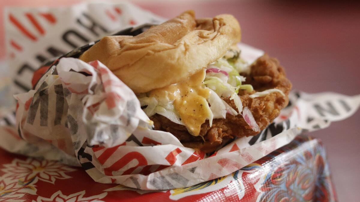 A fried chicken sandwich at Howlin' Ray's in Chinatown. They only make one thing — fried chicken — and they make it well.