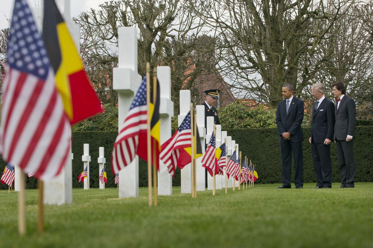 President Obama tours the American cemetery at Flanders Field with Belgian King Philippe and Belgian Prime Minister Elio Di Rupo.