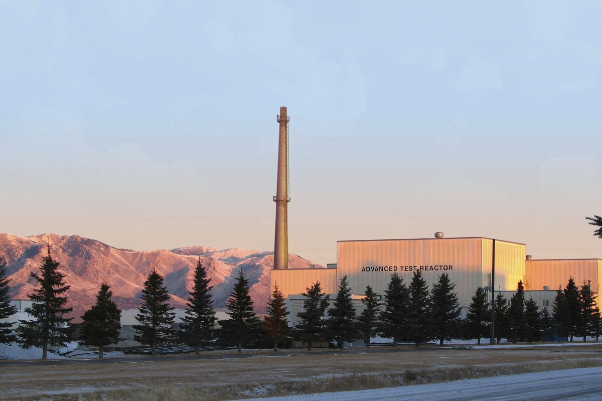 FILE - This photo released by Idaho National Laboratory shows its Advanced Test Reactor at Sunrise at Idaho National Laboratory's desert site about 50 miles west of Idaho Falls, Idaho, on Jan. 31, 2007. Scientists in Idaho have completed a rare overhaul of one of the world's most powerful nuclear test reactors. Officials at the Idaho National Laboratory said Monday, April 18, 2022, that normal operations are expected to resume later this spring at the Advanced Test Reactor following low-power system checks to make sure the reactor is in working order. (Idaho National Laboratory via AP, File)