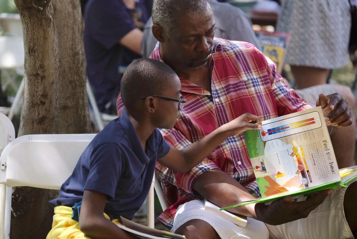 Families enjoy books together at Festival of Books.