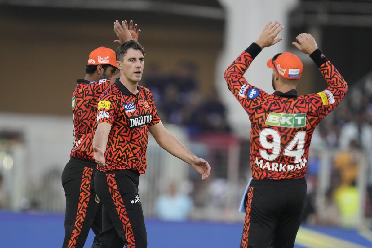 Sunrisers Hyderabad's Pat Cummins, second left, celebrates the wicket of Gujarat Titans' Sai Sudharsan during the Indian Premier League cricket match between Gujarat Titans and Sunrisers Hyderabad in Ahmedabad, India, Sunday, March 31, 2024. (AP Photo /Ajit Solanki)