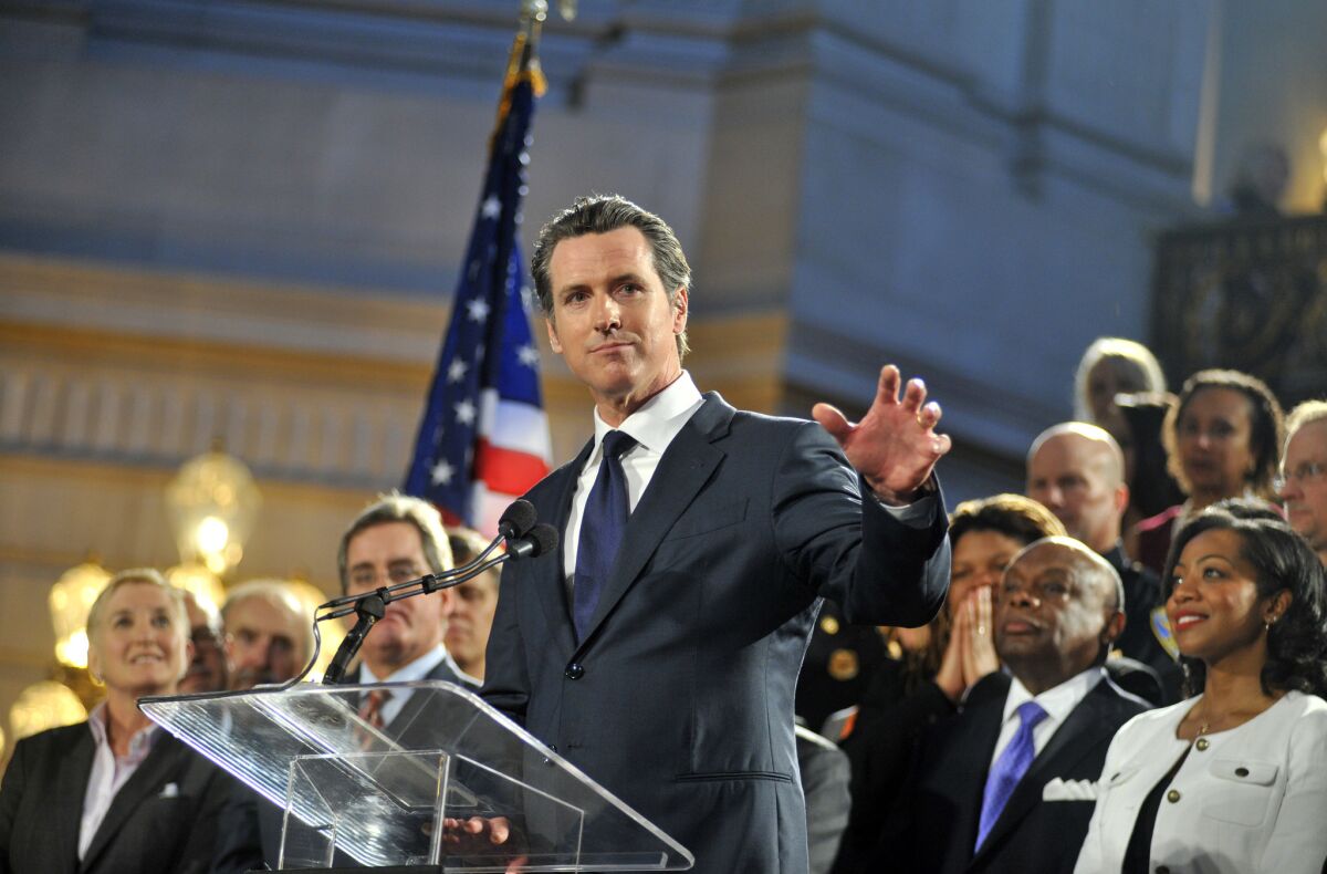 Former San Francisco Mayor Gavin Newsom delivers a speech inside City Hall in San Francisco, after the U.S. Supreme Court made its ruling on gay marriage on June 26, 2013.