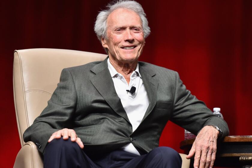 Recipient of the Fandango Fan Choice award for favorite film of 2014, "American Sniper's" Clint Eastwood speaks onstage during CinemaCon.