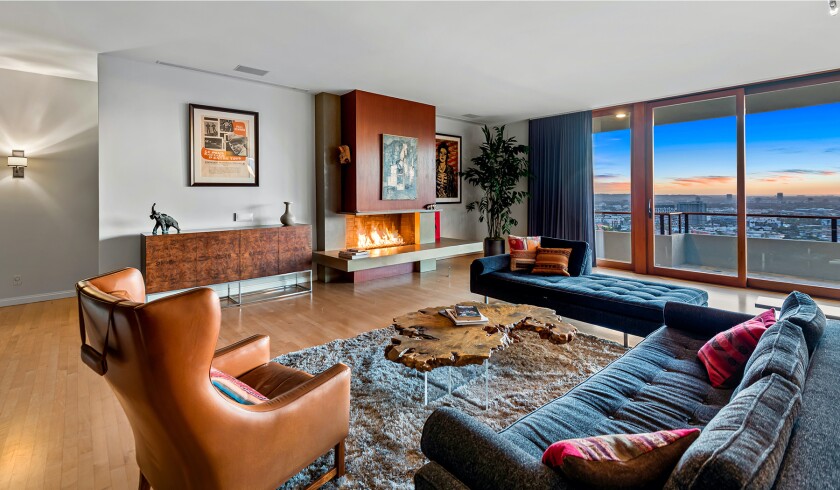 The hillside home includes three levels of decks, balconies and patios, as well as a swimming pool and spa.