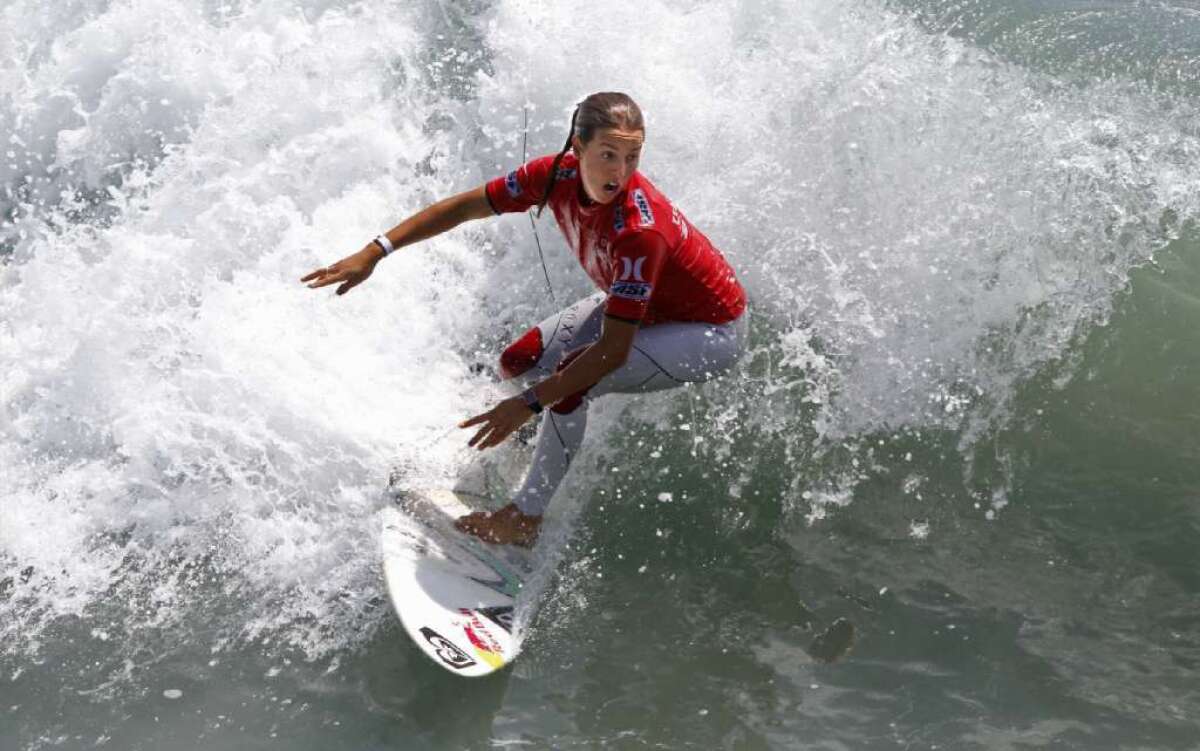 Sally Fitzgibbons attacks a wave at the U.S. Open of Surfing at Huntington Beach last year.