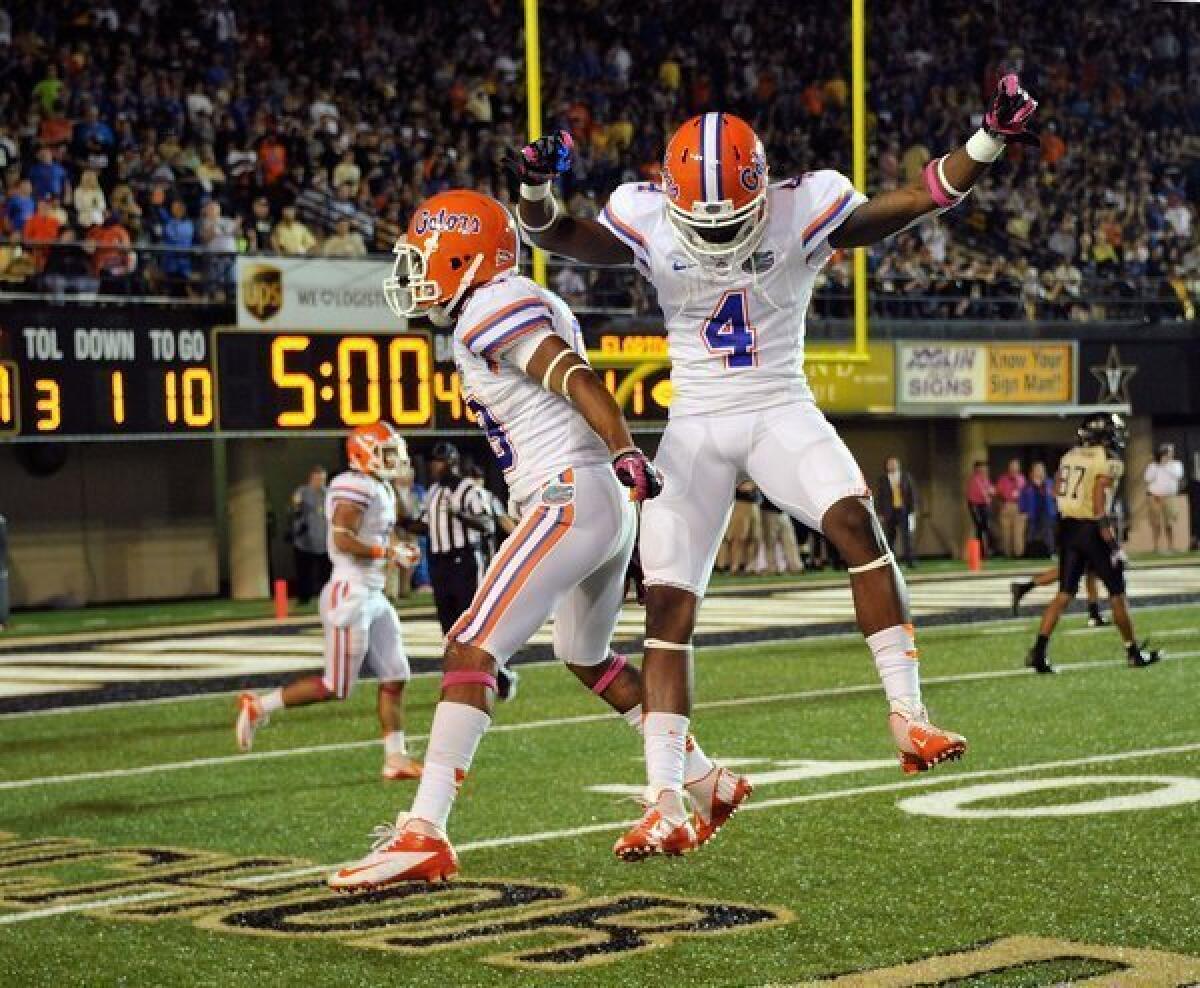 Solomon Patton, left, and Andre Debose of the Florida Gators celebrate a play against the Vanderbilt Commodores on Saturday.