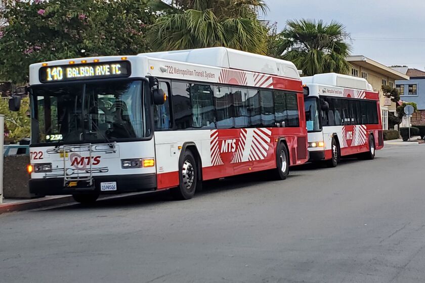 Two Route No. 140 busses sit on Silverado Street in La Jolla.