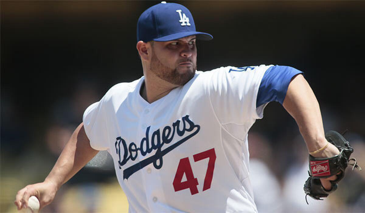 Dodgers pitcher Ricky Nolasco throws against the Colorado Rockies on Sunday.