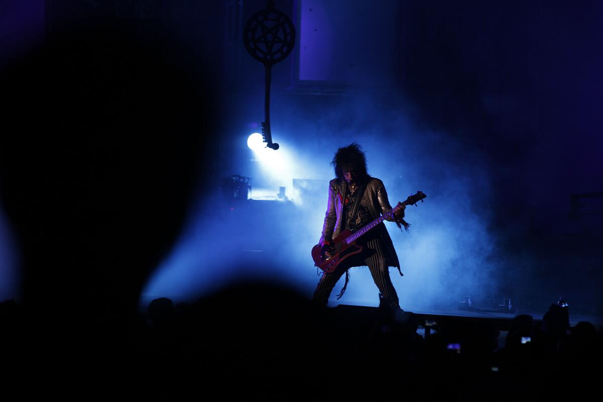 Nikki Sixx plays bass with Mötley Crüe, which performed at the Hollywood Bowl on Monday night during what was billed as "the final tour." Our critic called the band "the Gary Busey of rock."