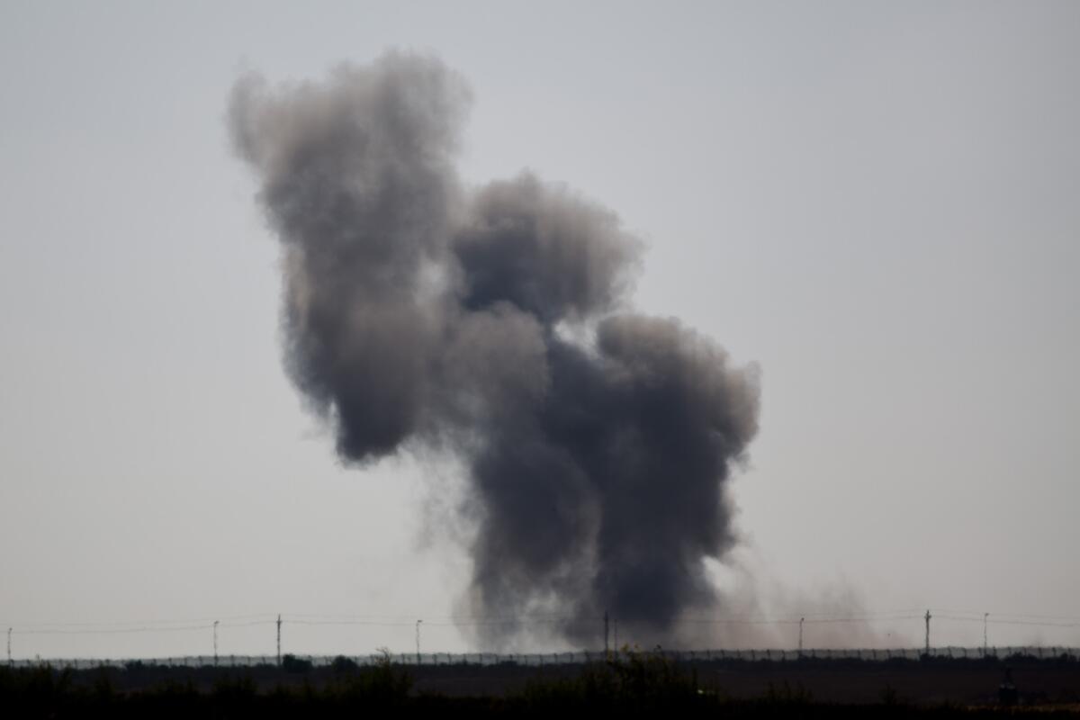 Smoke rises after an explosion in Egypt's northern Sinai Peninsula, as seen from the Israel-Egypt border near the southern Israeli town of Kerem Shalom, on July 1.