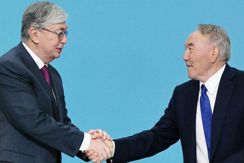 Former Kazakh president Nursultan Nazarbayev shakes hands with President Kassym-Jomart Tokayev during a congress of the ruling Nur Otan party in Nur-Sultan on April 23, 2019. - Kazakhstan's ruling party nominated a loyalist to the country's longtime leader as its presidential candidate on April 23, 2019, setting the stage for a smooth handover of power in the Central Asian nation. (Photo by Stanislav FILIPPOV / AFP)STANISLAV FILIPPOV/AFP/Getty Images ** OUTS - ELSENT, FPG, CM - OUTS * NM, PH, VA if sourced by CT, LA or MoD **