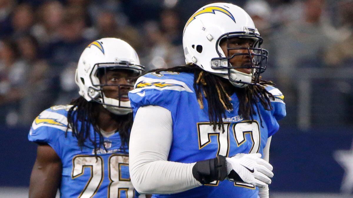 Chargers offensive tackle Joe Barksdale, walking in front of running back Melvin Gordon, is playing with a nagging toe injury.