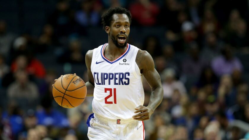 Clippers shooting guard Patrick Beverley controls the ball during a game against the Charlotte Hornets on Feb. 5. Beverley agreed to a three-year, $40 million contract with the Clippers on Sunday.