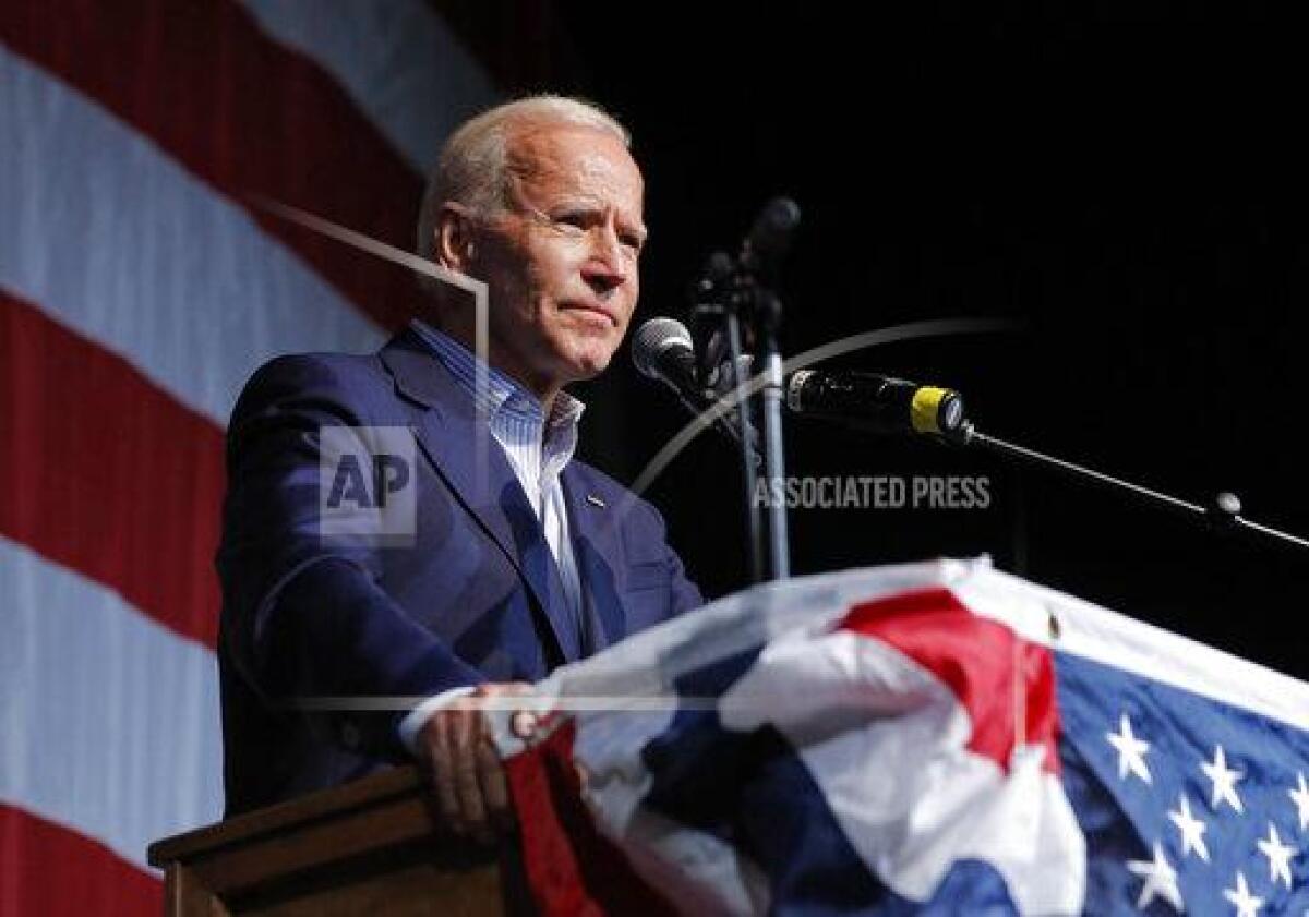 President Biden stands at a lectern