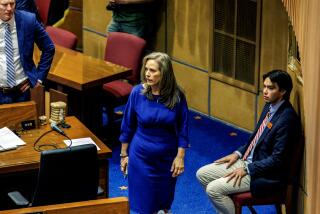 PHOENIX, AZ - APRIL 17, 2024: Arizona Sen. Shawnna Bolick walks in the senate chambers on April 17, 2024 in Phoenix, Arizona. She is married to Arizona Supreme Court Justice Clint Bolick who was part of the court's 4-seat majority that allowed enforcement of an 1864 law prohibiting abortions except when a mother's life was at risk. She voted to repeal it.(Gina Ferazzi / Los Angeles Times)
