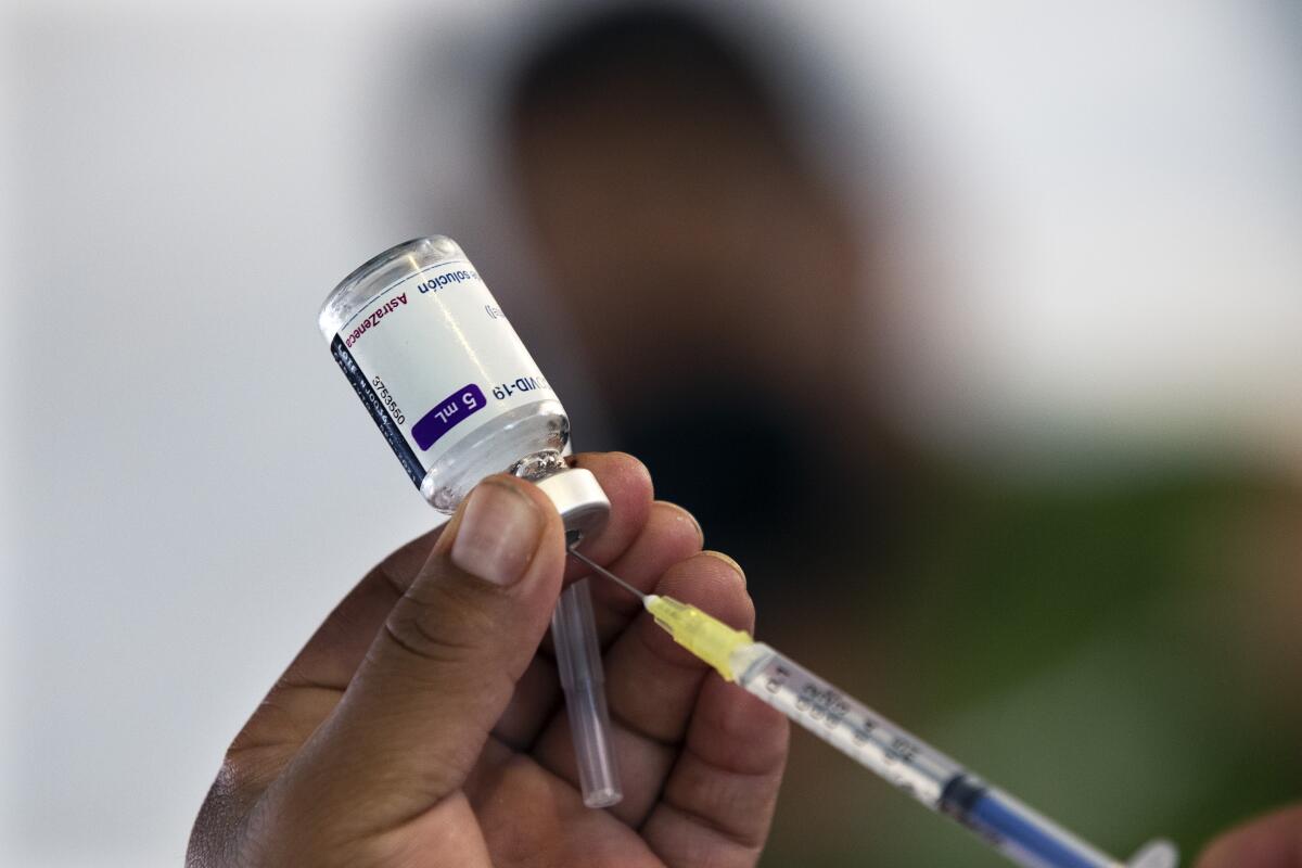 A health worker in Mexico City prepares to administer a dose of AstraZeneca's COVID-19 vaccine.