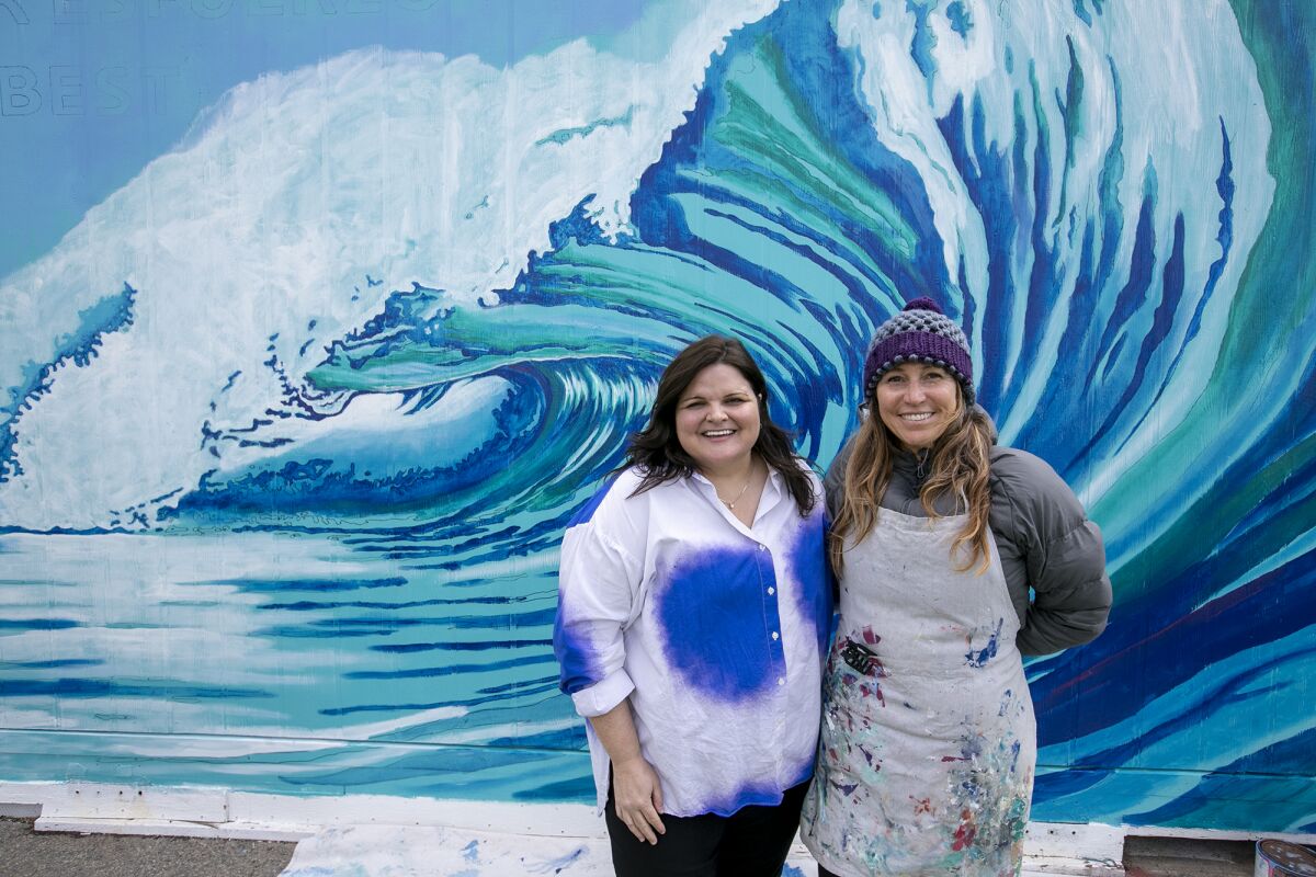 Ensign Intermediate School Principal Samantha Payne, left, and local artist Jennifer Bloomfield.