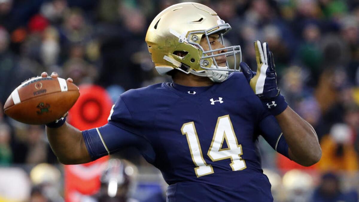 Notre Dame quarterback DeShone Kizer looks to pass against Virginia Tech during the first half of their game.
