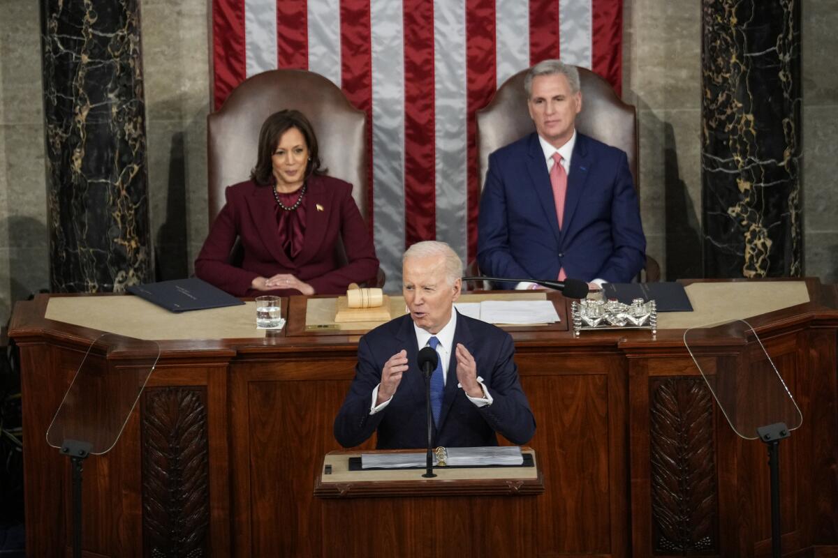 Vice President Kamala Harris and then-House Speaker Kevin McCarthy sitting behind President Biden as he speaks in Congress