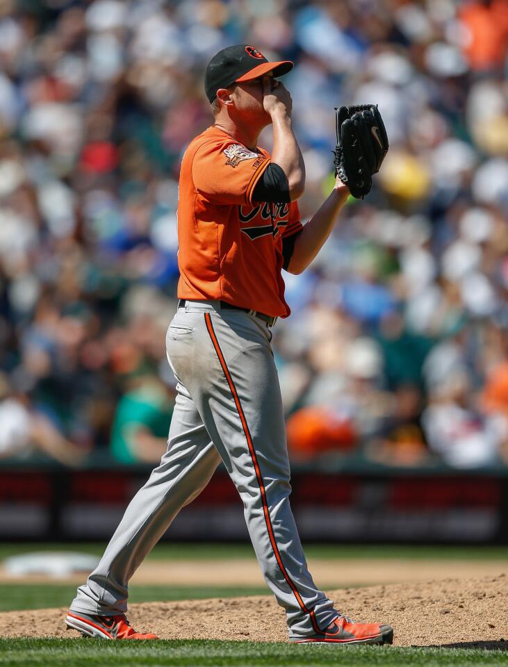 Bud Norris pauses on the mound after giving up an RBI double to Seattle's Robinson Cano in the fifth inning.
