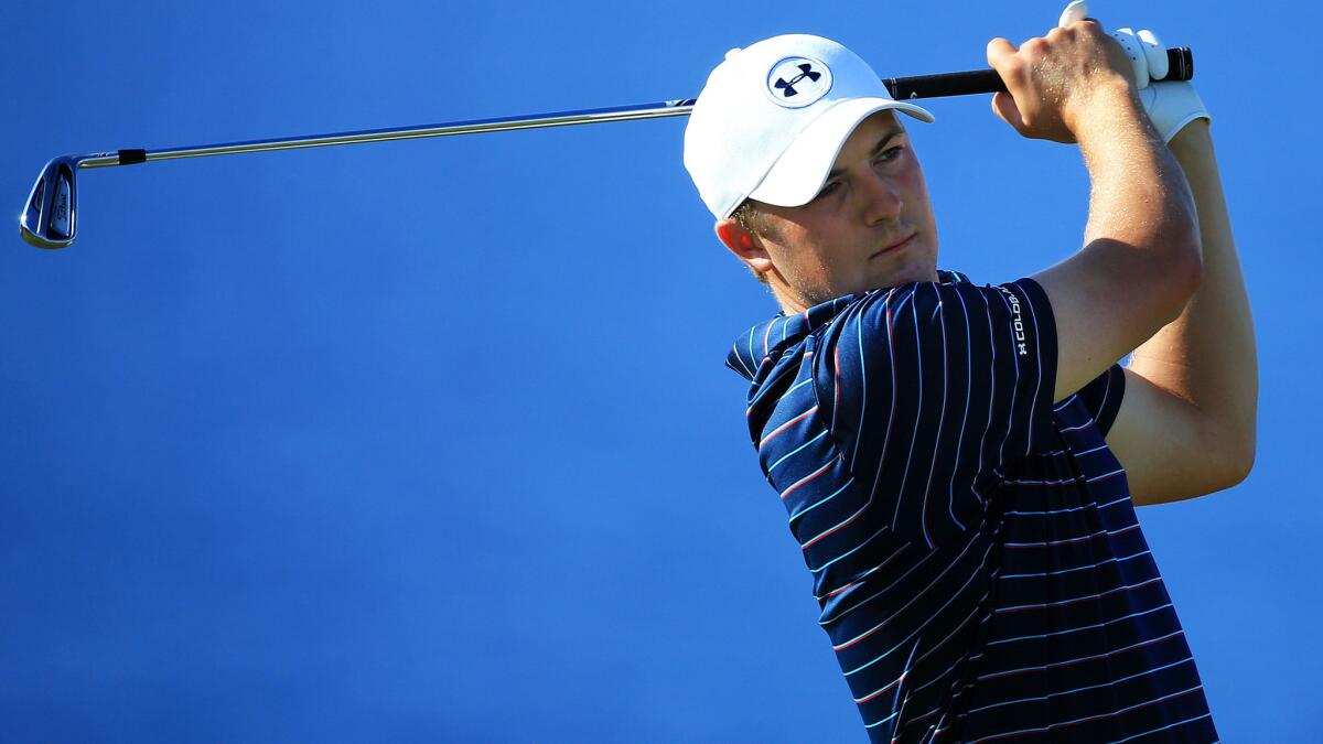 Jordan Spieth hits his tee shot at No. 13 during the final round of the Hyundai Tournament of Champions on Sunday.