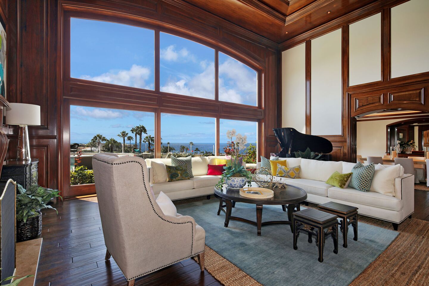 A wall of windows brings ocean views into the living room.