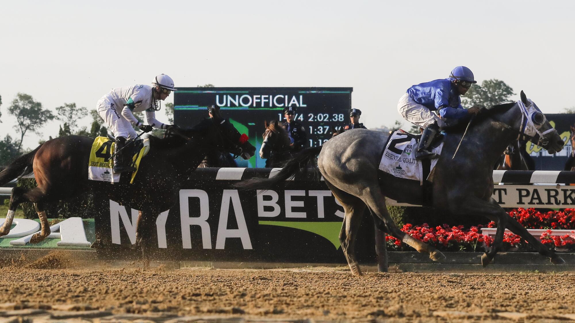 Essential Quality crosses the finish line ahead of Hot Rod Charlie to win the 153rd running of the Belmont Stakes