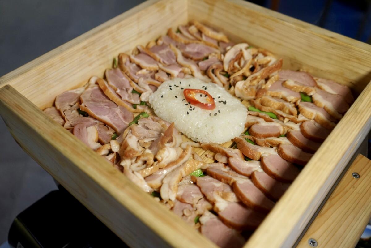The smoked duck in Hinoki wood from the Korean Koreatown Korean kitchen.