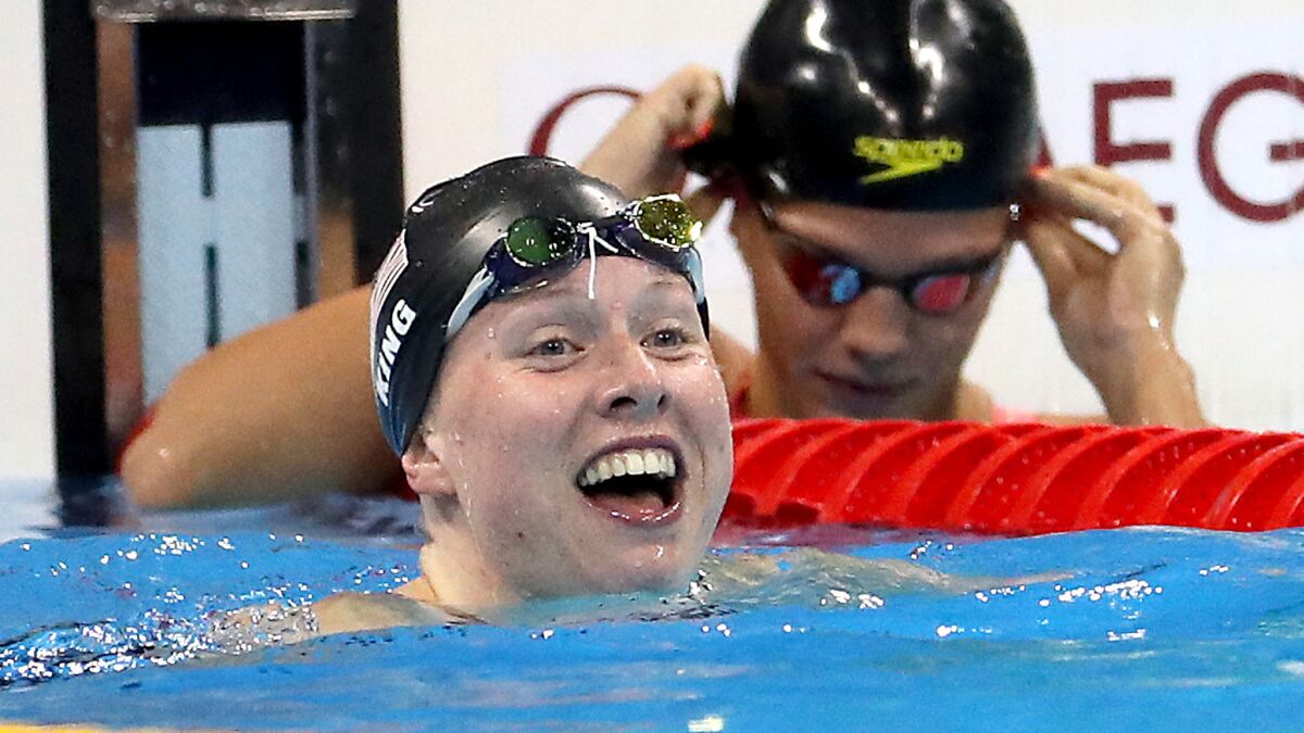 American swimmer Lilly King is all smiles after defeating rival Yulia Efimova of Russia for gold in the women's 100-meter breaststroke on Monday.