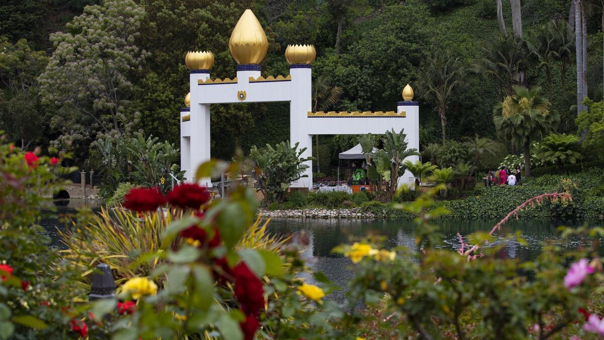 The Golden Lotus Archway can be seen from across the lake in the Meditation Gardens at the Lake Shrine Self Realization Fellowship silence retreat in Pacific Palisades, Calif.