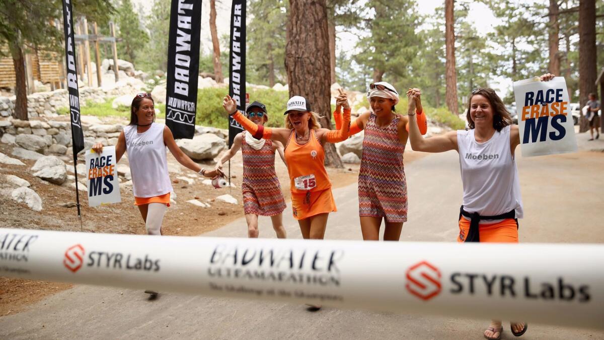 Shannon Farar-Griefer crosses the finish line with her support crew in the STYR Labs Badwater 135 Ultramarathon in Death Valley. Farar-Griefer was the last person to finish the race with a time of 46 hours, 10 minutes, 46 seconds.