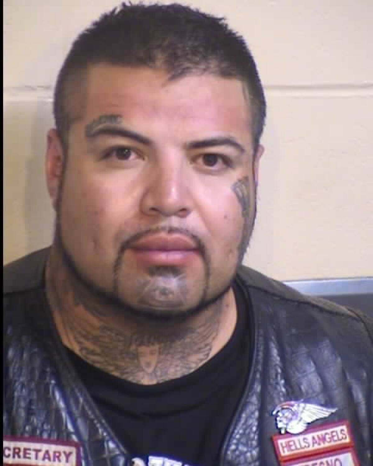 Officials arrested 31-year-old Rey Rodriguez on suspicion of being a felon in possession of a firearm.