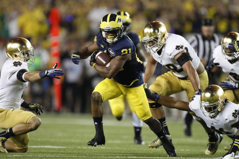 Michigan's Jeremy Gallon breaks Notre Dame tackles on his way to a touchdown last year.