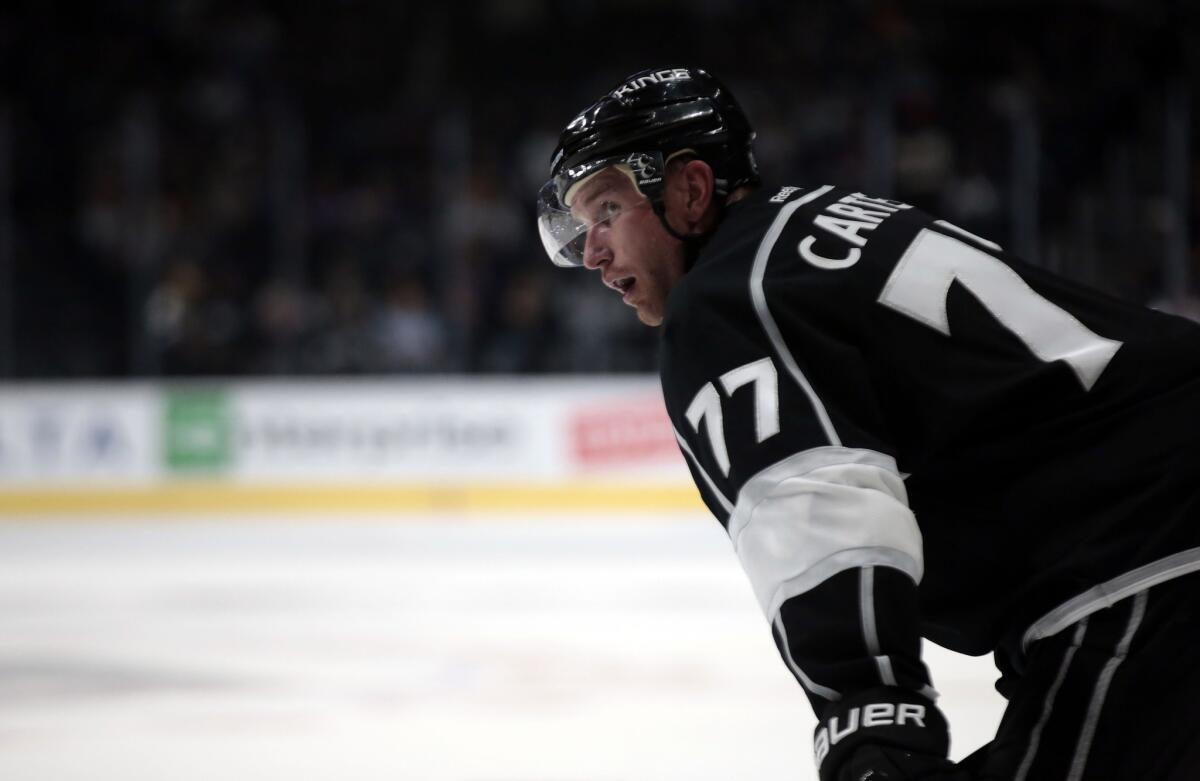 Kings center Jeff Carter looks up to the stands.